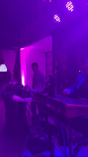 Musicians perform at Montenegro bar with outdoor crowd gathering