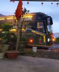 Two buses face off with headlights on in Vietnam