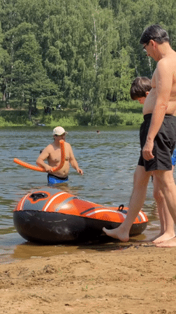 Summer beach day unfolds in Malakhovka, Russia with families