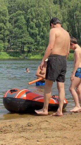 Summer beach day unfolds in Malakhovka, Russia with families