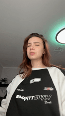 Woman takes mirror selfie in Russian apartment