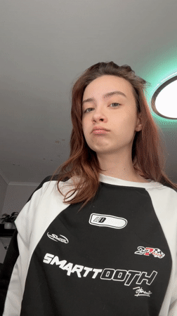Woman takes mirror selfie in Russian apartment