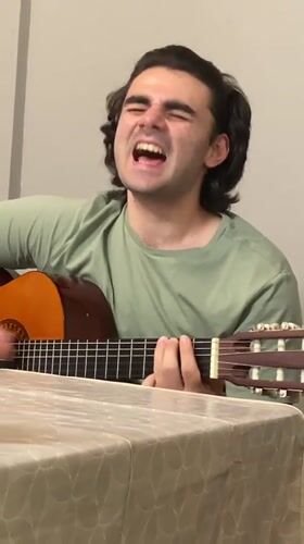 Acoustic guitar performance captured in Ruse home setting