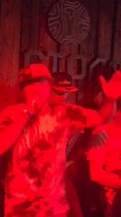 Band performs live show in Moscow venue under red lighting