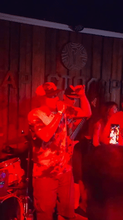 Band performs live show in Moscow venue under red lighting
