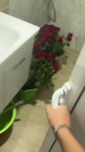 Large red rose bouquets arranged in bathroom, floors in Bulgaria