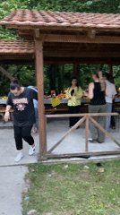 Community gathering with dancing, food, and outdoor festivities