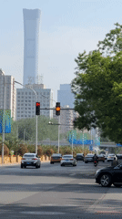 Morning bicycle commute documented in Beijing's business district
