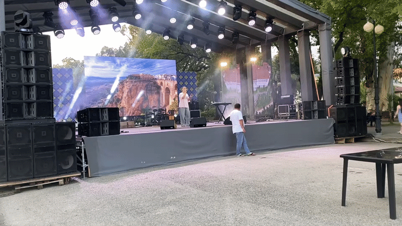 Live outdoor concert in Sokhumi with stage, screens, and performers