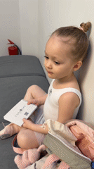 Young ballerina with notebook observed in Moscow home