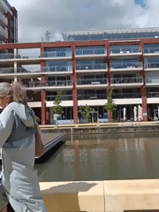 Pedestrians and cyclists share bridge walkway in Leuven