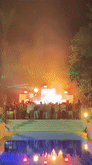 Nighttime outdoor party in Savyon with stage lights and fog