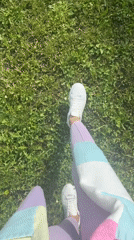 Morning walker captured in park setting wearing purple clothing