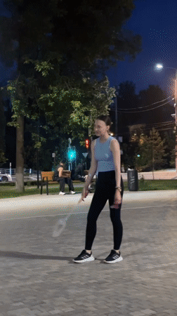 Late-night badminton practice under the streetlights in Krasnogorsk