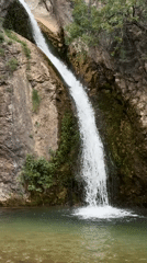 Waterfall observed flowing into clear pool in Rafailovići, Montenegro