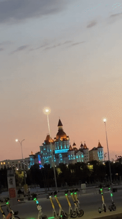 Castle-like building illuminated at dusk in Sirius, Russia