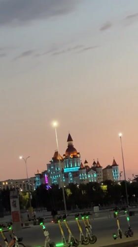 Castle-like building illuminated at dusk in Sirius, Russia