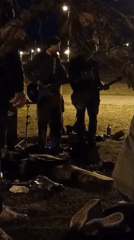 Evening social gatherings and skateboarding observed in Barcelona park
