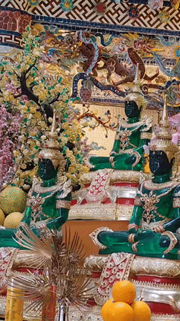 Ornate Buddhist statues at a temple in Xuân Thành, Vietnam