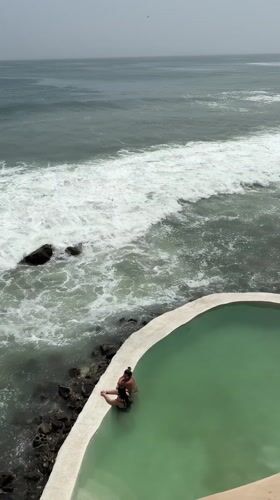 Dakar scenes: poolside couple and luxury car spotted