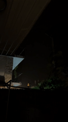 Illuminated object spotted over residential Nesebar during rainy night