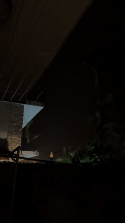 Illuminated object spotted over residential Nesebar during rainy night