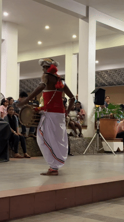 Traditional drummer performs for audience in Kudamaduwella, Sri Lanka