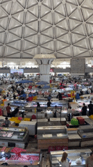 Morning market activity documented in Tashkent's indoor bazaar