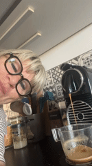 Woman makes morning coffee in Chambœuf kitchen