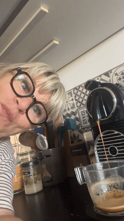 Woman makes morning coffee in Chambœuf kitchen
