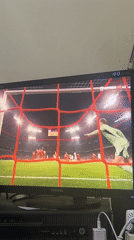 Soccer match viewed on monitor in Harmanli, Bulgaria