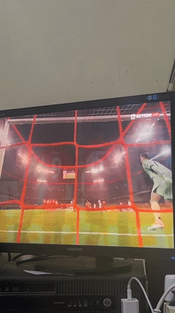 Soccer match viewed on monitor in Harmanli, Bulgaria