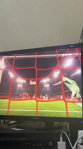 Soccer match viewed on monitor in Harmanli, Bulgaria