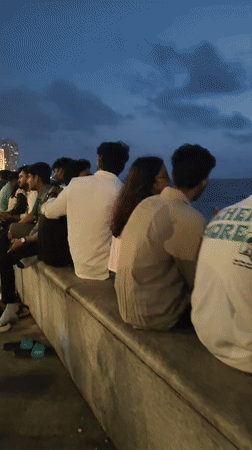 Evening crowd lines Marine Drive as Mumbai's skyline comes alive