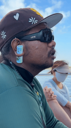 Man with unusual ear accessory spotted on boat in Indonesia