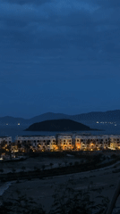Illuminated skyscrapers captured at dusk in Nha Trang, Vietnam