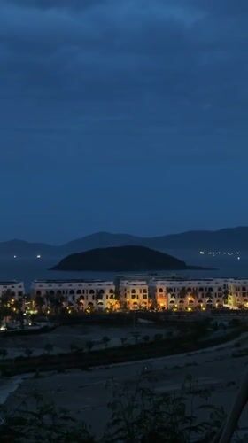 Illuminated skyscrapers captured at dusk in Nha Trang, Vietnam