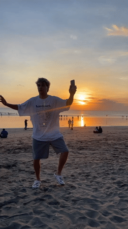 Tourists enjoy sunset, shopping, surfing in Kuta Indonesia