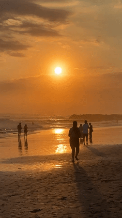 Sunset beach scene with swimmers captured in North Kuta