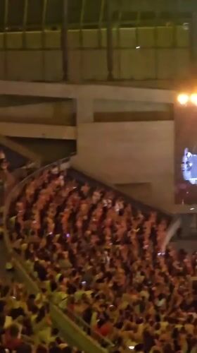 Packed arena concert lights up Barcelona on a July evening