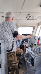 Man observed gesturing on ship bridge near Rodionovo, Russia