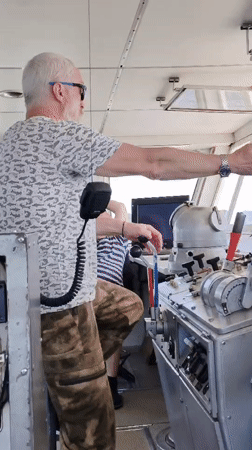 Man observed gesturing on ship bridge near Rodionovo, Russia