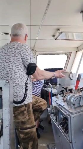 Man observed gesturing on ship bridge near Rodionovo, Russia