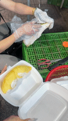 Fruit vendors prepare durian, watermelons at Nha Trang market