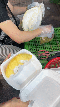 Fruit vendors prepare durian, watermelons at Nha Trang market