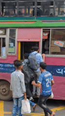 Early morning street life continues in Dhaka intersection