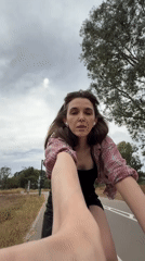 Woman films selfie while cycling in Tel Aviv