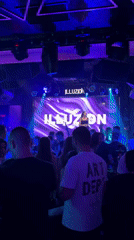 Three performers entertain at Sofia nightclub under blue lights