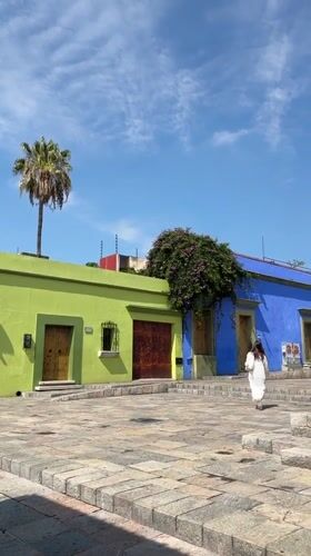 Daily life unfolds in Oaxaca City's colorful plazas