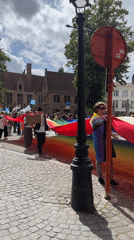 Pride celebration through historic Bruges streets and squares